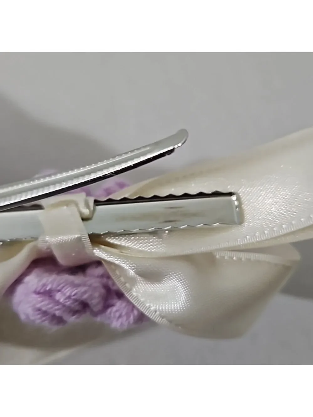 Hand Crafted Ivory Bow with Purple Crochet Flower